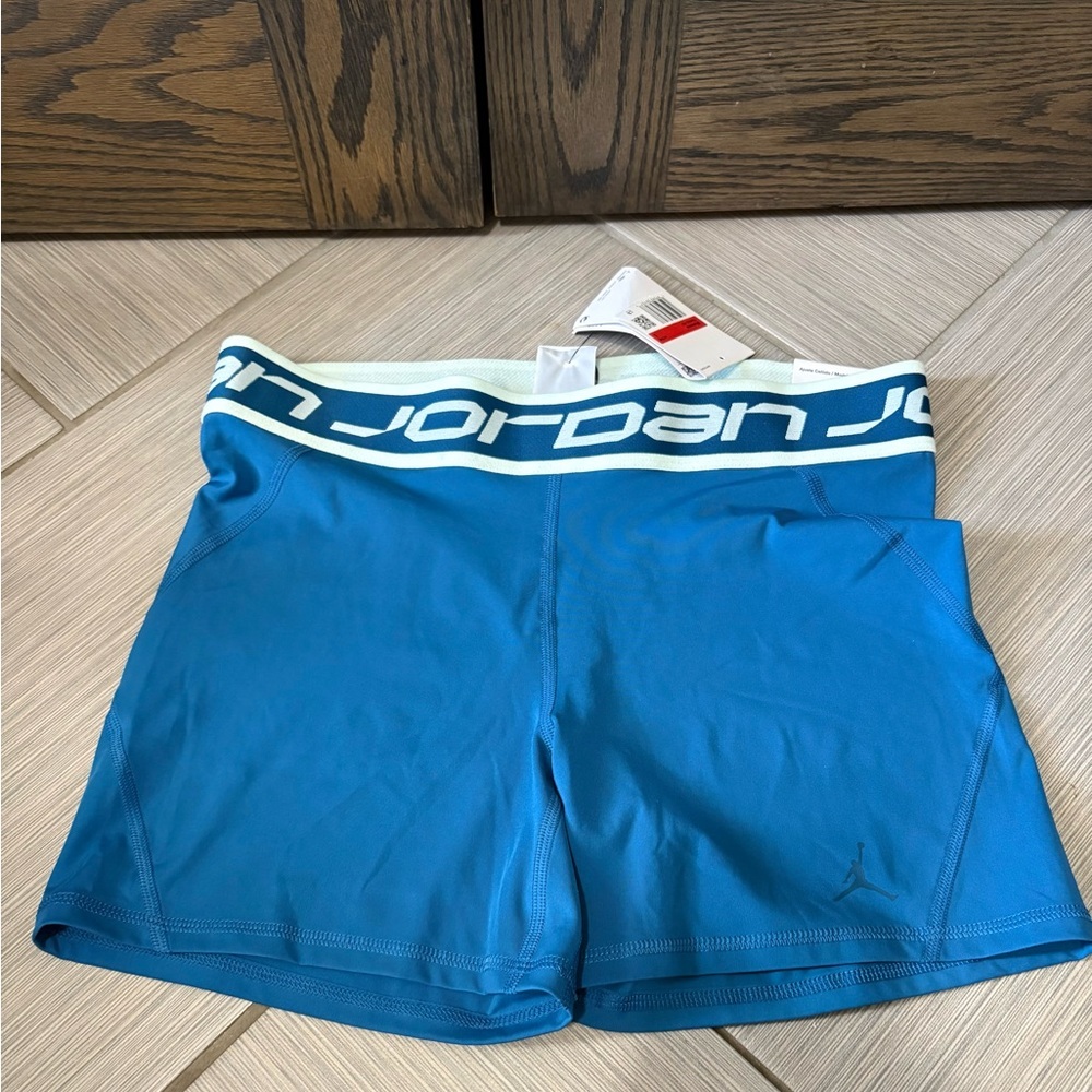 Nike Women's Blue Athletic Shorts with Bold Waistband